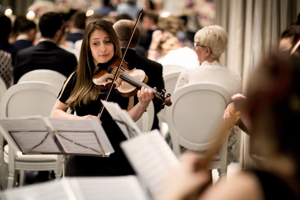 Guide To Booking Music For Your Wedding - A string quartet performing during the wedding breakfast