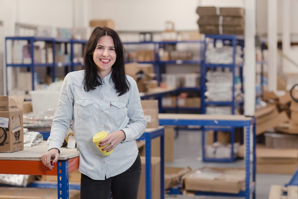 Photo of Steph Douglas at the Don't Buy Her Flowers Warehouse.